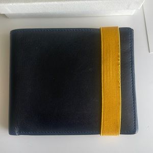Vintage Agnes B. black folding leather wallet with yellow elastic closure